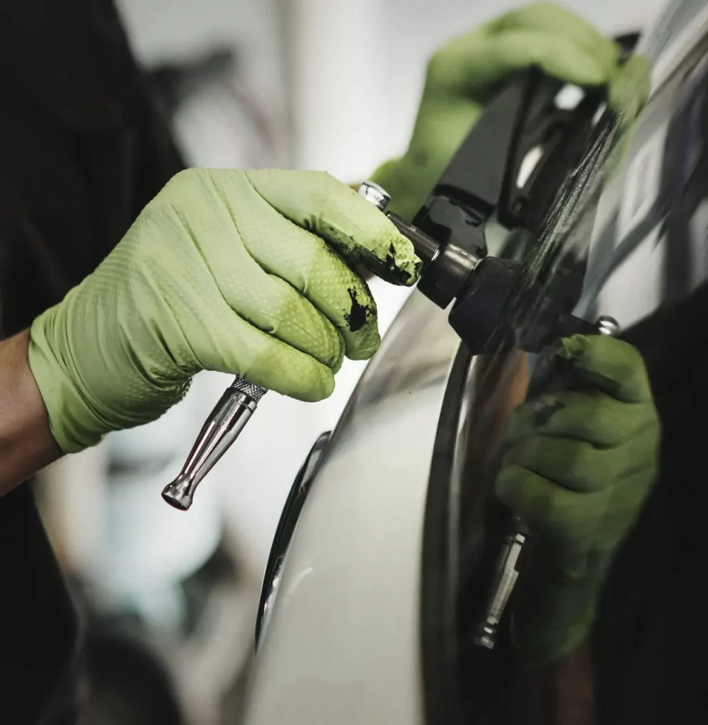 Mechanic removing car wiper arm